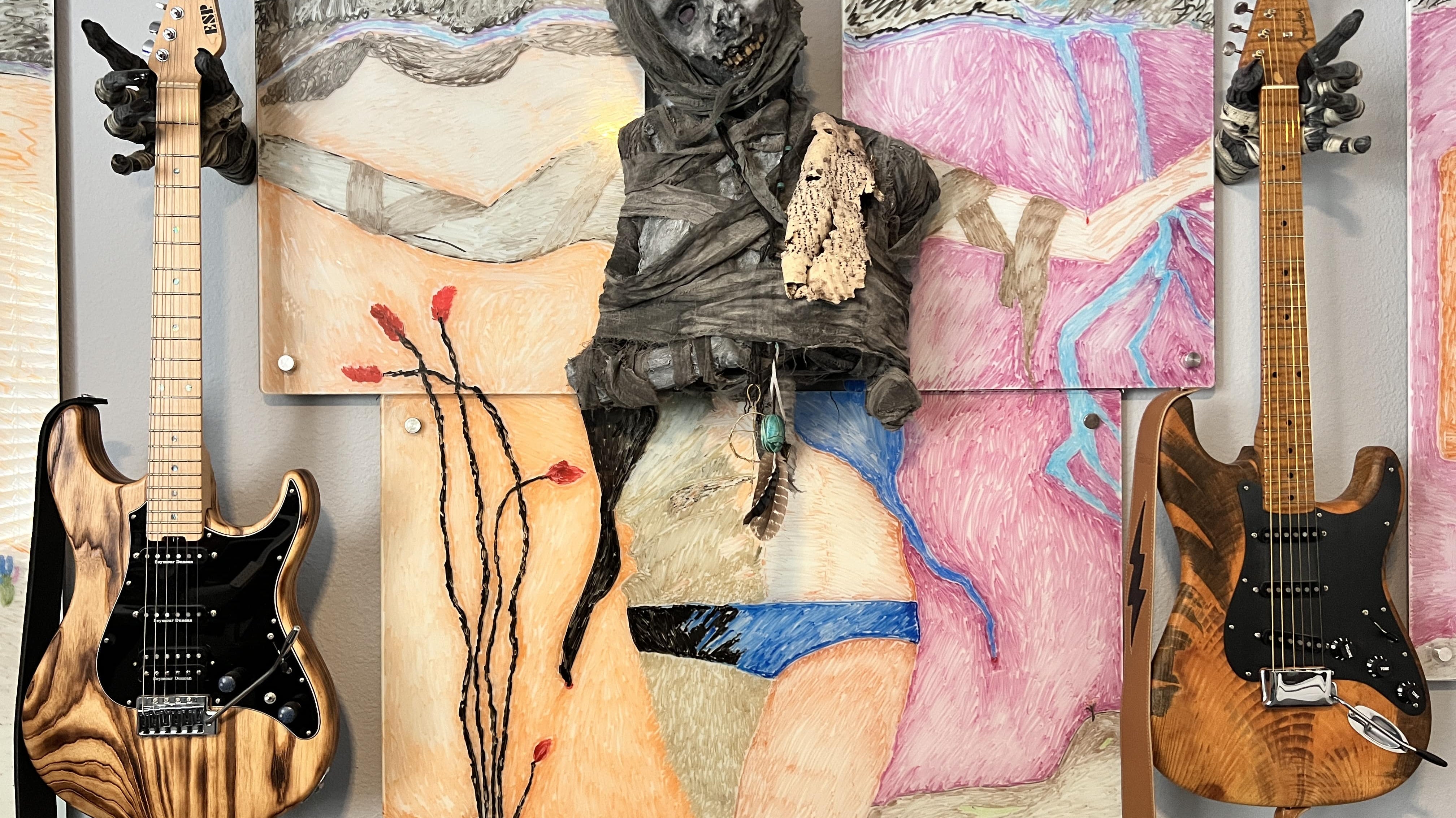 Mummy monster hand guitar hanger display and storage mounts.