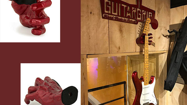 guitar hanger holding red fender stratocaster. Also, 2 red hand guitar hangers.