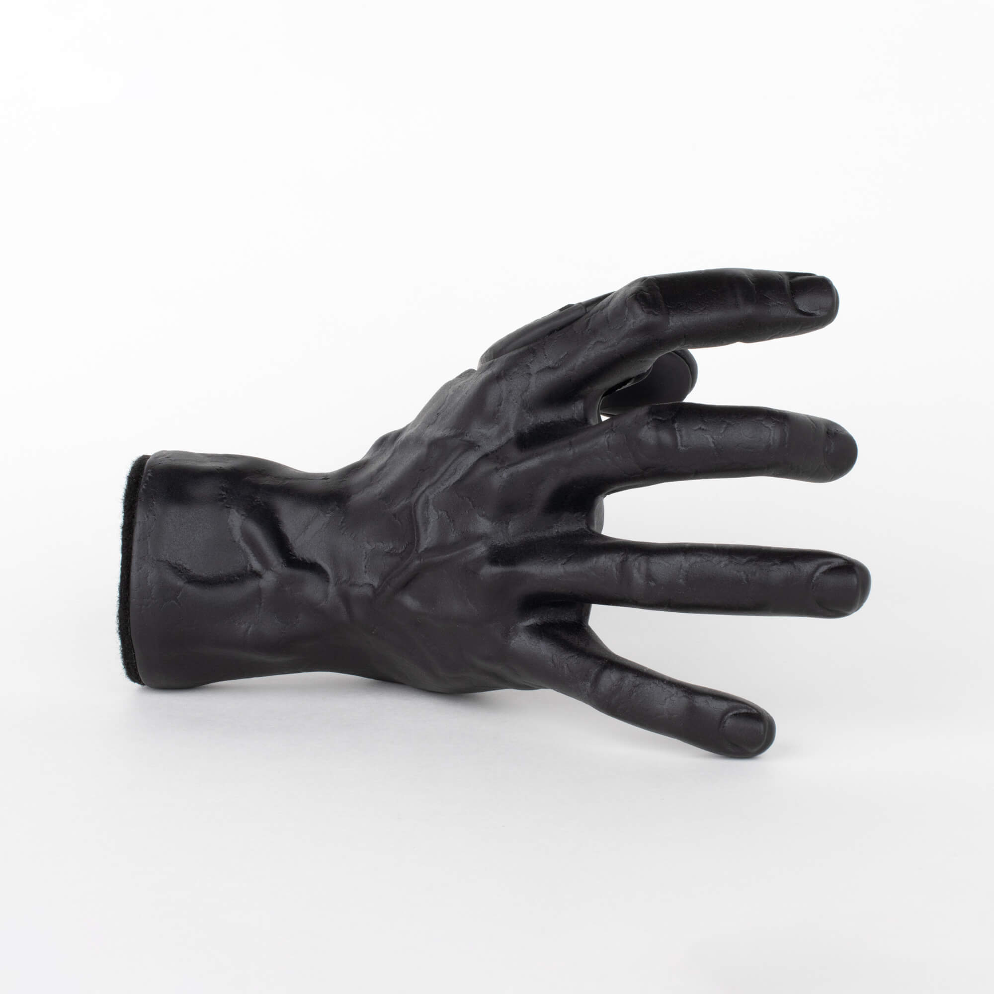 Guitar wall stand in the shape of a hand made by GuitarGrip.