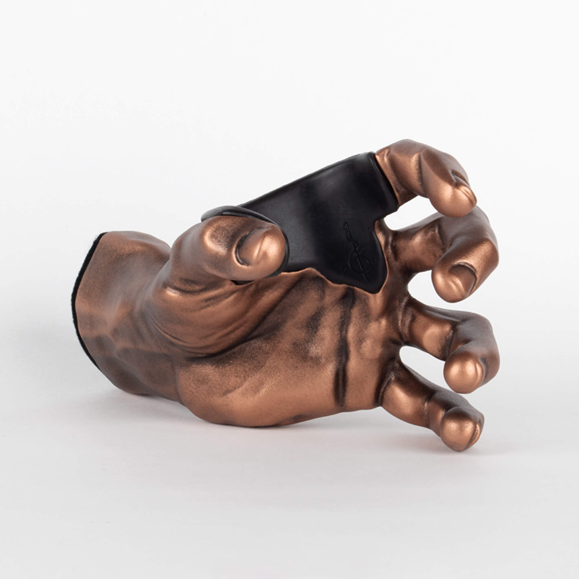 Inside view of copper male hand guitar wall mount hook.