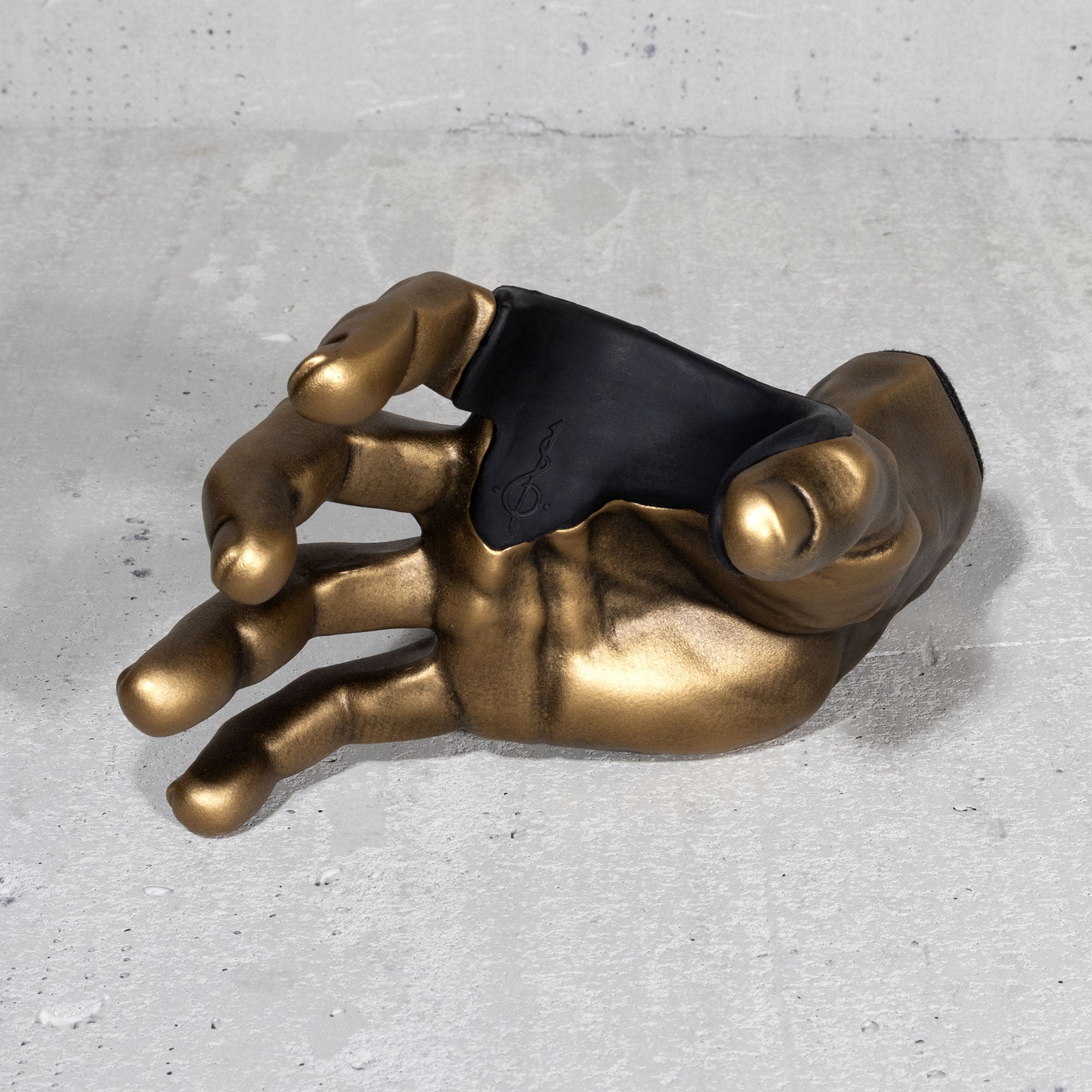 Right male hand in gold finish for hanging electric and acoustic guitar from the wall. Front view.