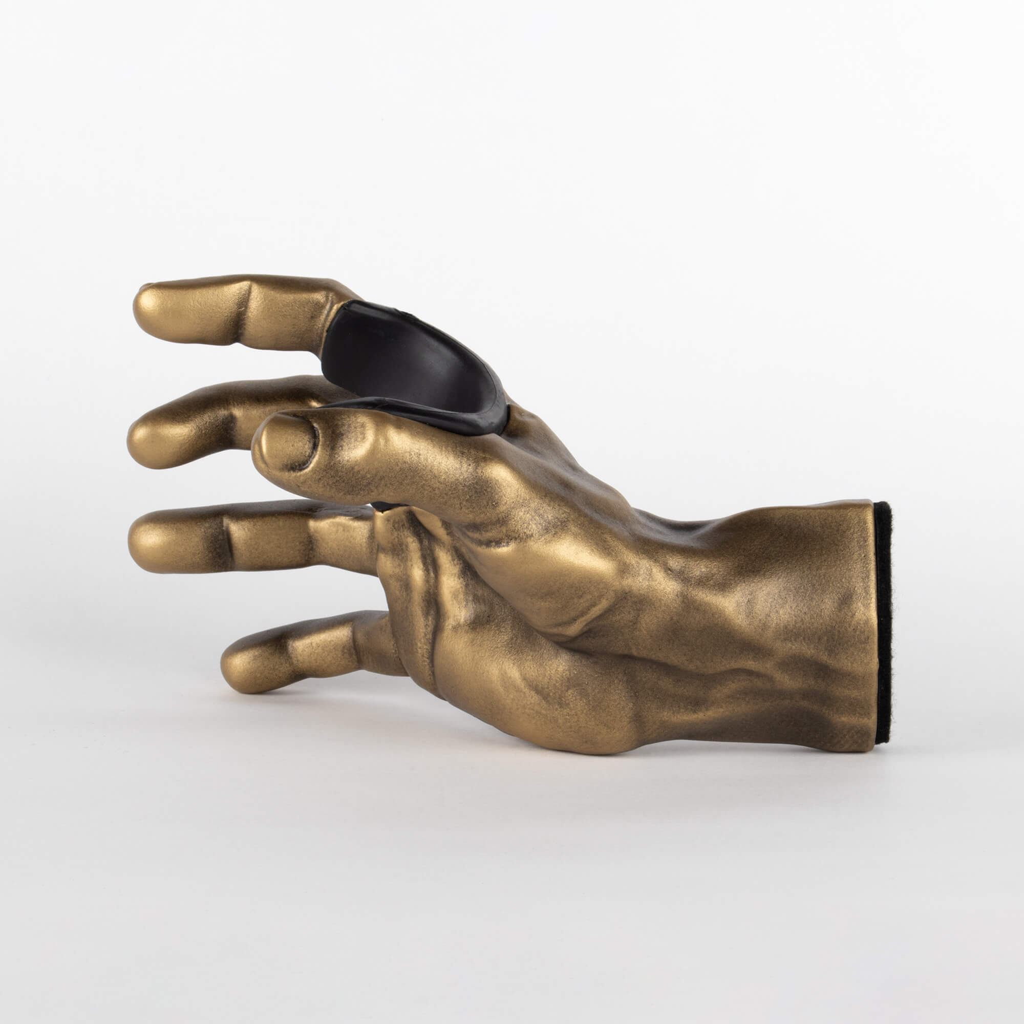 Inside view of gold hand guitar hooks for wall.