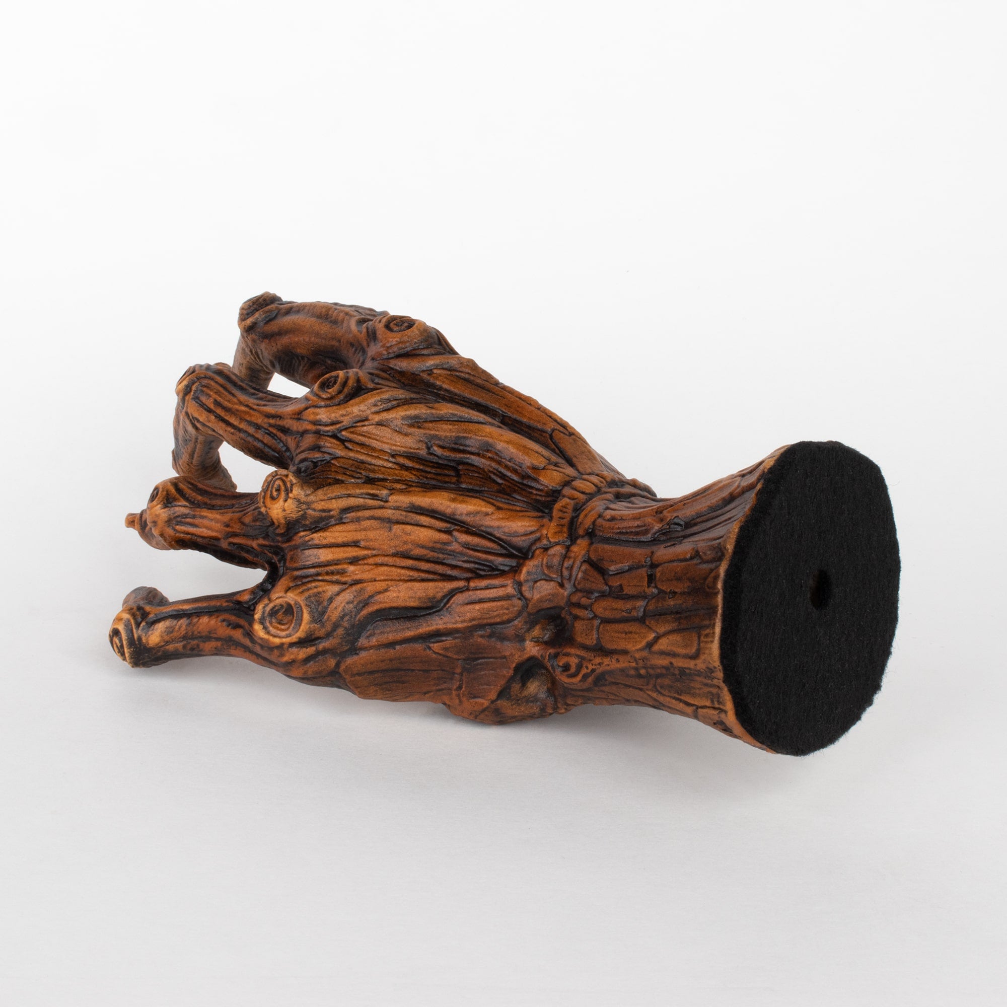 Back view of tree hand guitar hanger wall mount.