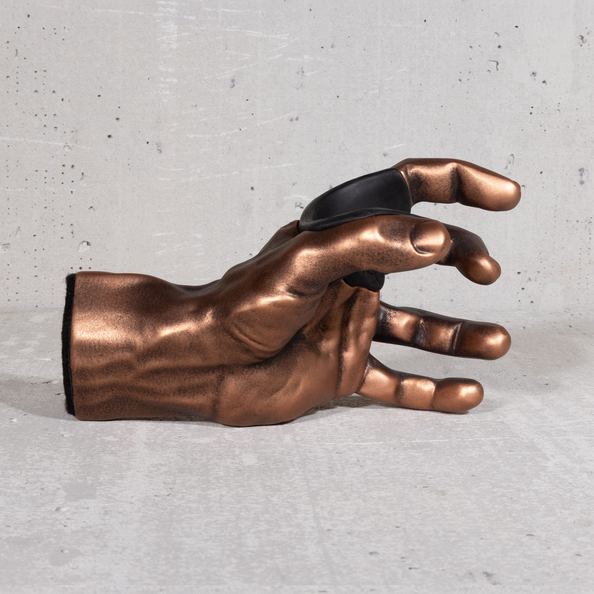 Copper GuitarGrip left-hand guitar wall hanger displayed in a horizontal side view.