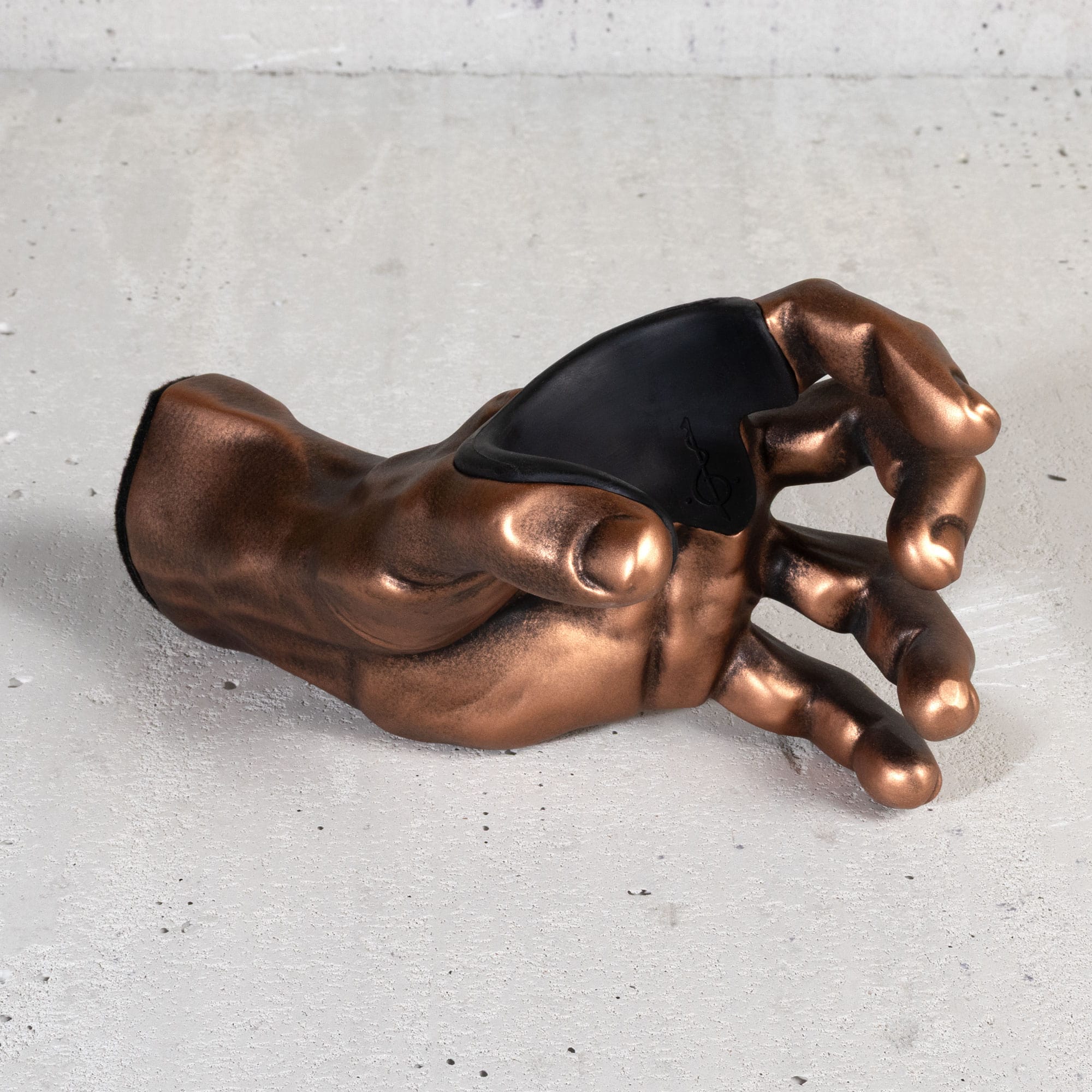 Copper GuitarGrip left-hand guitar holder shown from a top view highlighting the inner cradle.