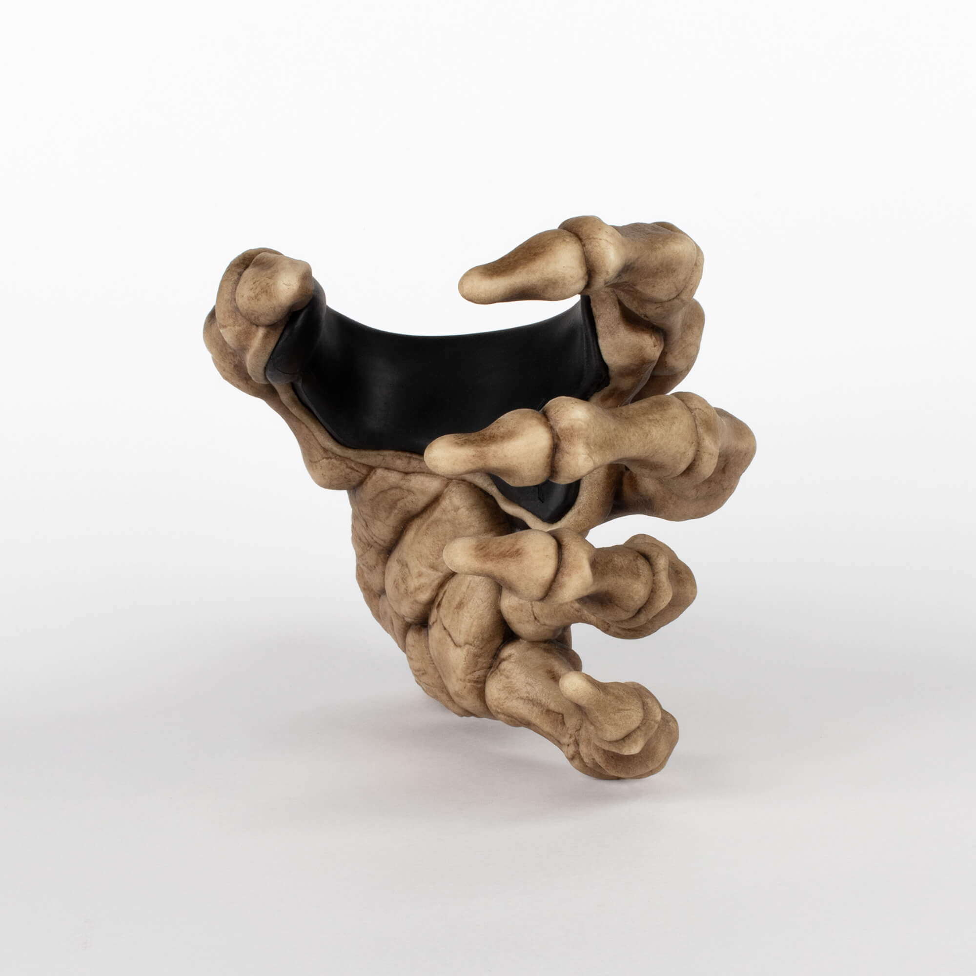 Front view of skeleton bone left hand guitar wall display rack for home or studio use, on white background.