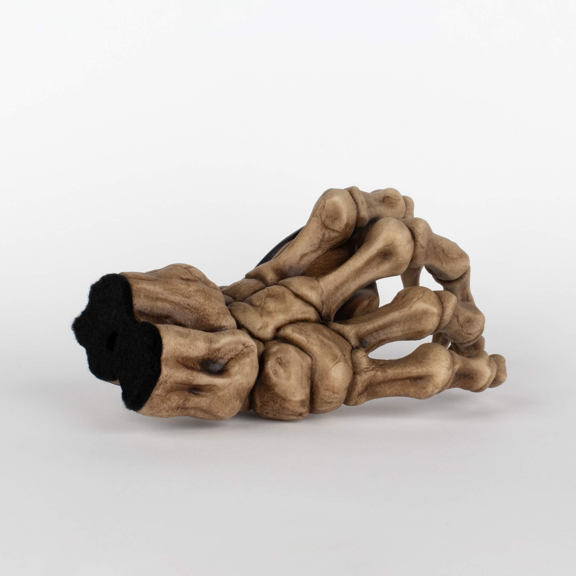 Back view of bass guitar instrument wall mount to display instruments in the shape of a skeleton right hand.