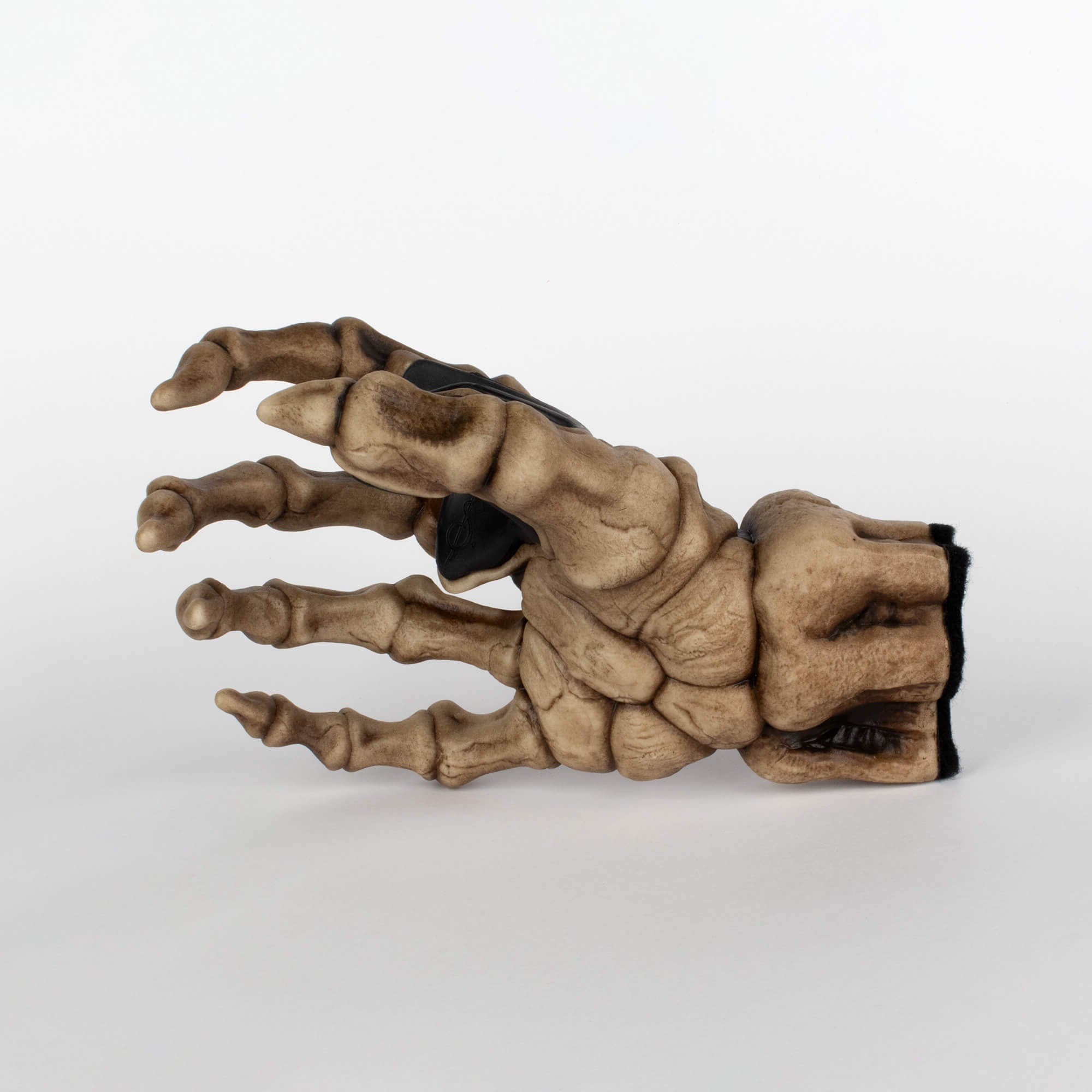 Skeleton right hand guitar holder to hang bass guitar and electric guitar on the wall. Showing on white background.