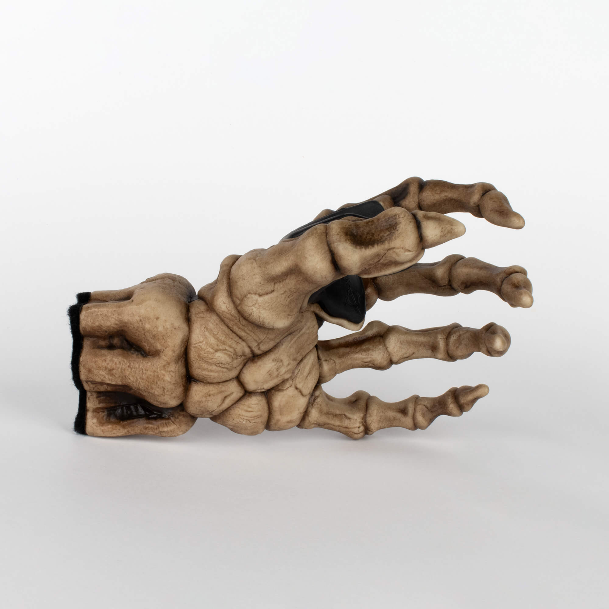 Skeleton left hand guitar holder to hang bass guitar and electric guitar on the wall. Showing on white background.