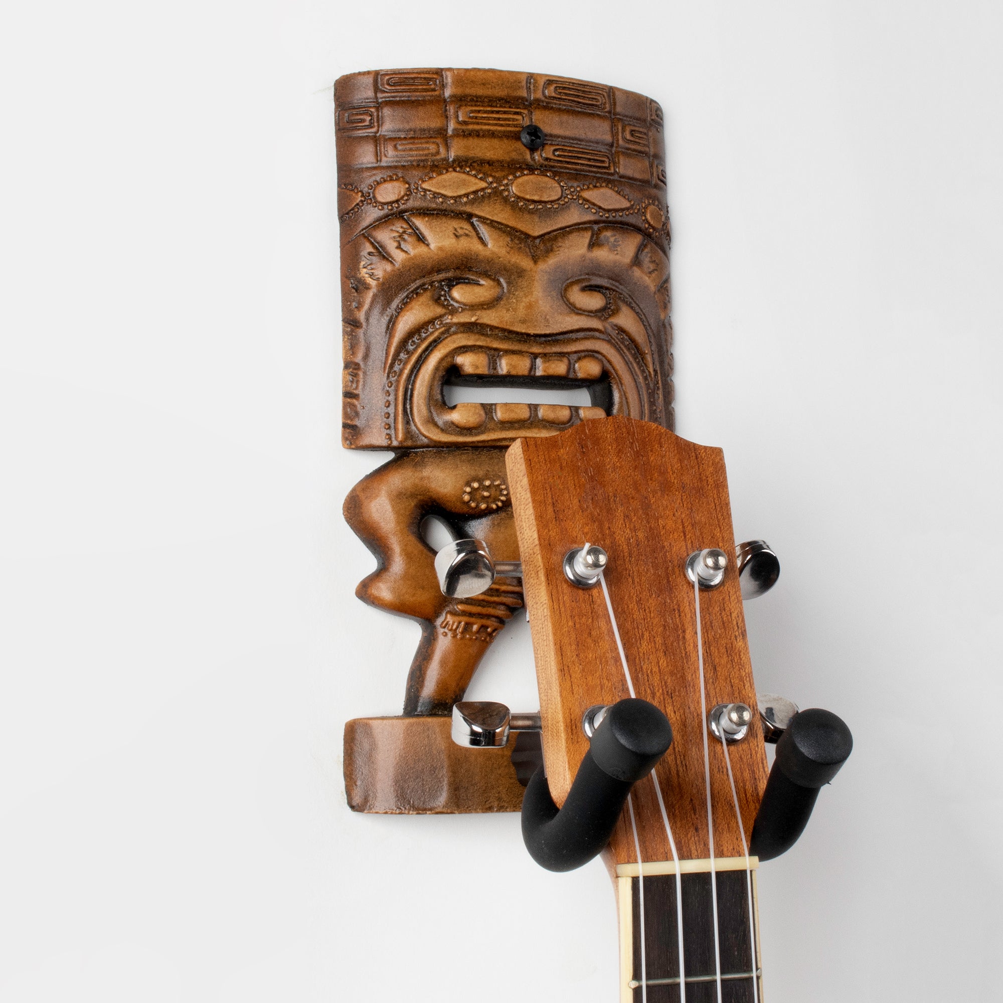Brown acoustic tiki wall hanger hook.