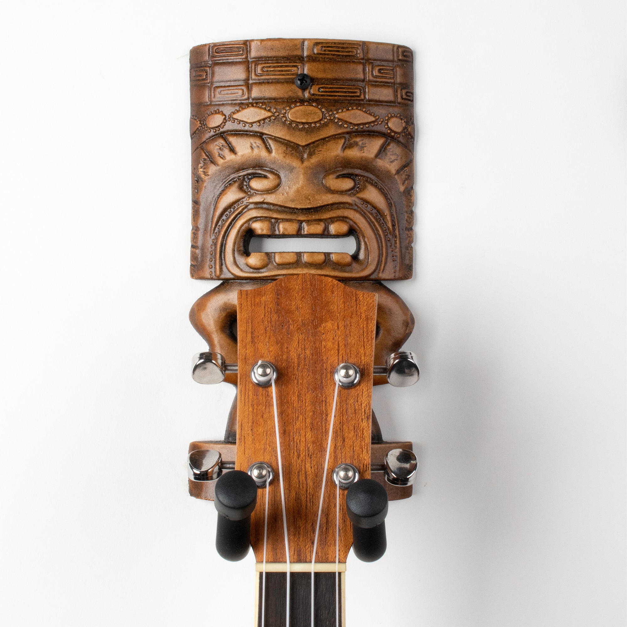 Brown uke wall display mount.