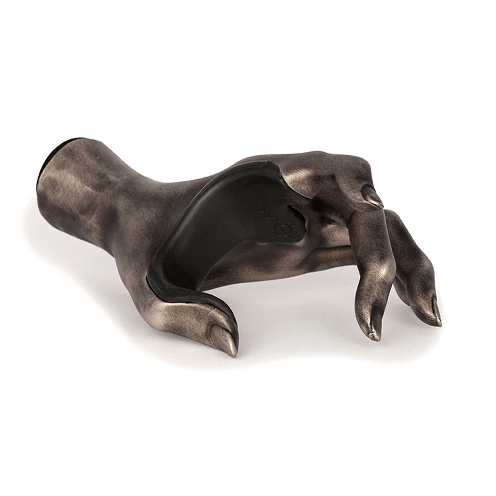 Alternative to guitar stand for wall hanging. Silver female hand front view.