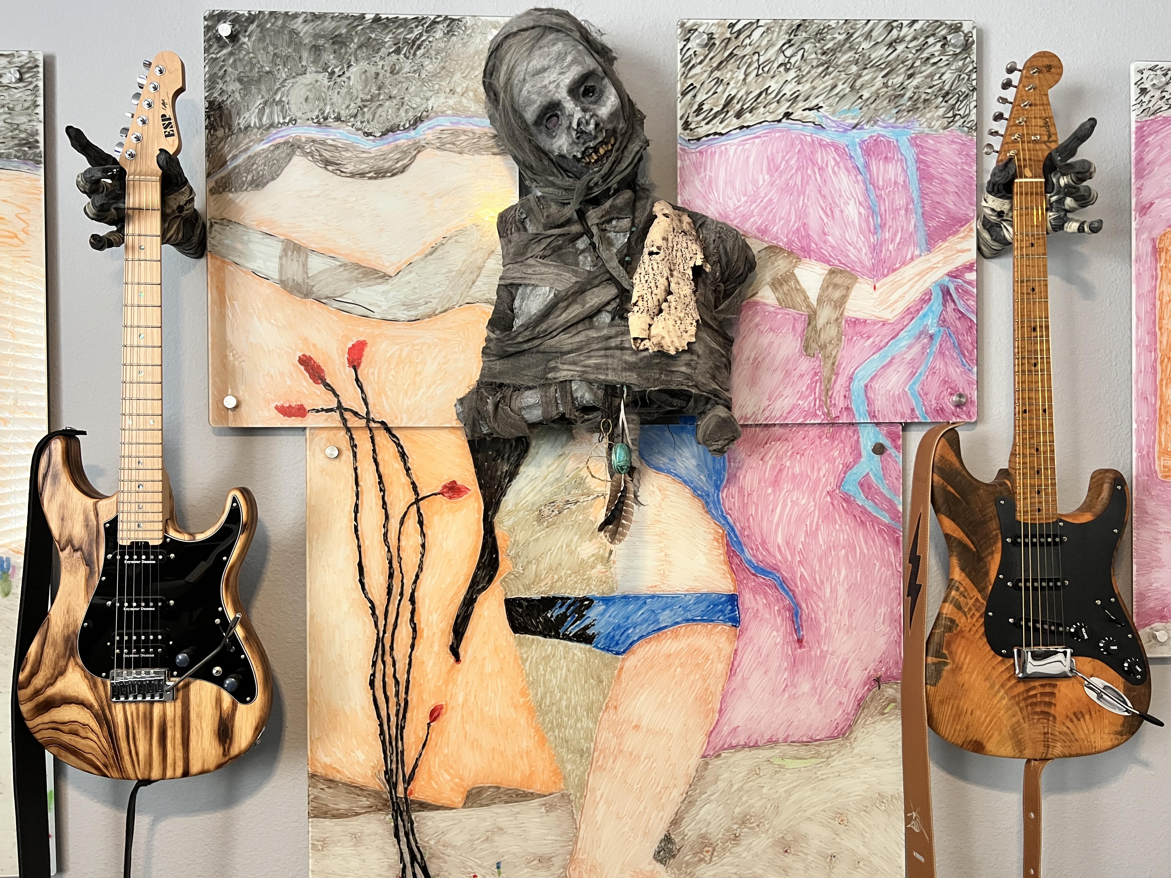 Mummy monster hand guitar hanger display and storage mounts. 