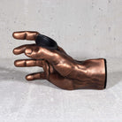 Guitargrip hand shaped guitar hanger inside view on grey background.