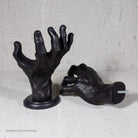 Black decorative wall mount for hanging guitars on the wall.
