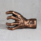 Copper GuitarGrip left-hand guitar wall mount displayed from the outer sculpted side.