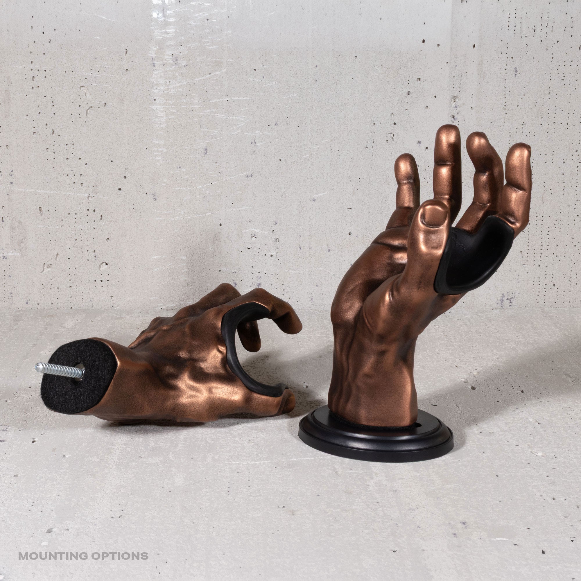 Copper GuitarGrip left and right guitar wall hangers shown with both mounting bases.