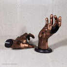 Copper GuitarGrip left and right guitar wall hangers shown with both mounting bases.