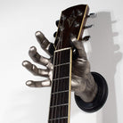 Silver hand shaped guitar hanger wall mounts from GuitarGrip.