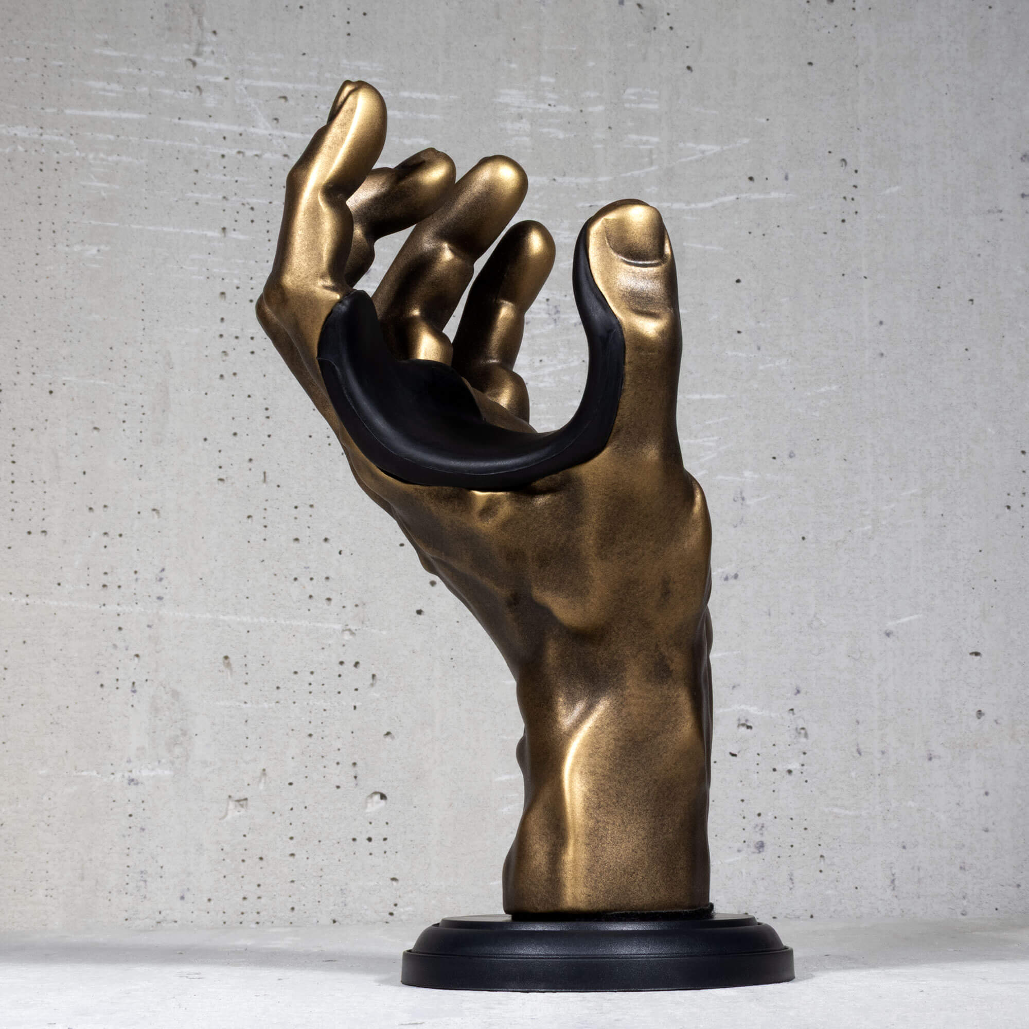 Gold antiqued hand wall hanger for guitar and bass.