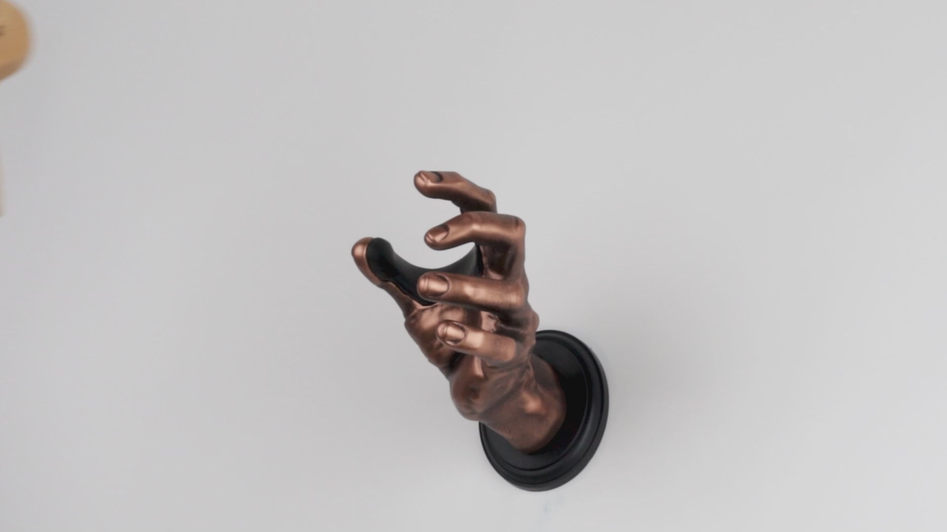 Video showing GuitarGrip hand shaped guitar hangers in 4 different colors and guitar going in and out of the wall mounted guitar hook.